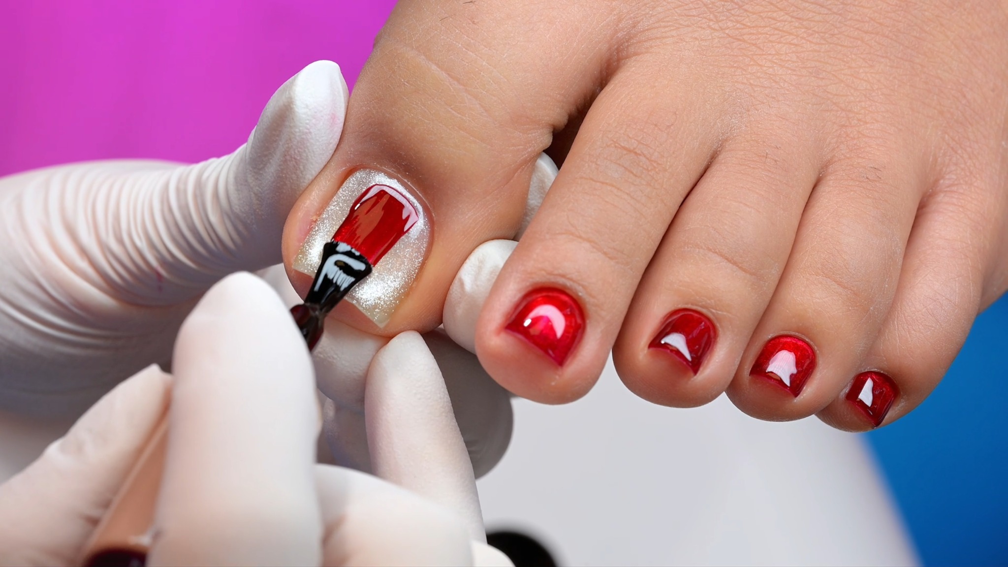 Applying red gel polish