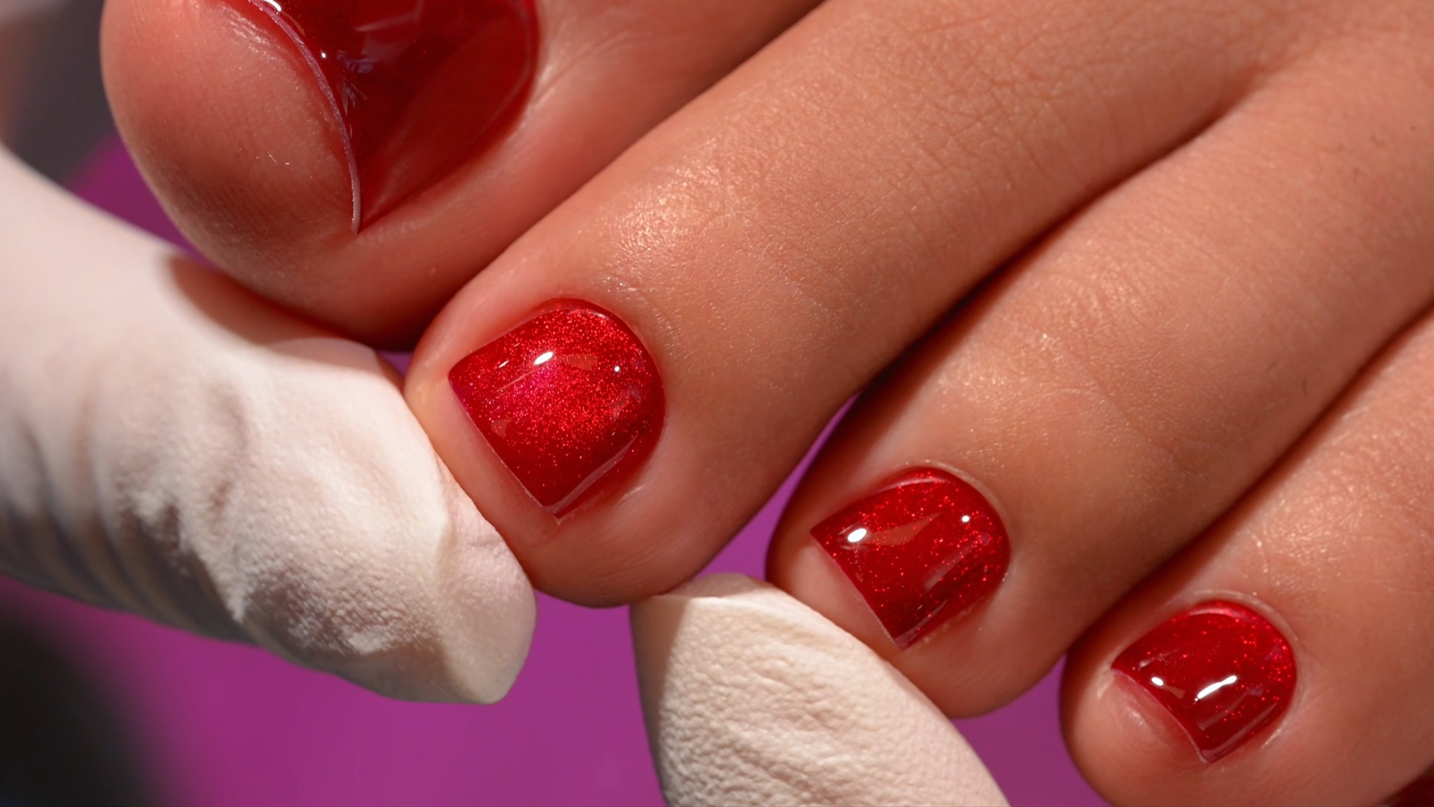 Close-up of the finished red gel pedicure